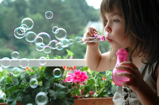 child blowing flower photo: blowing bubbles GIRL-BLOWING-BUBBLES.jpg