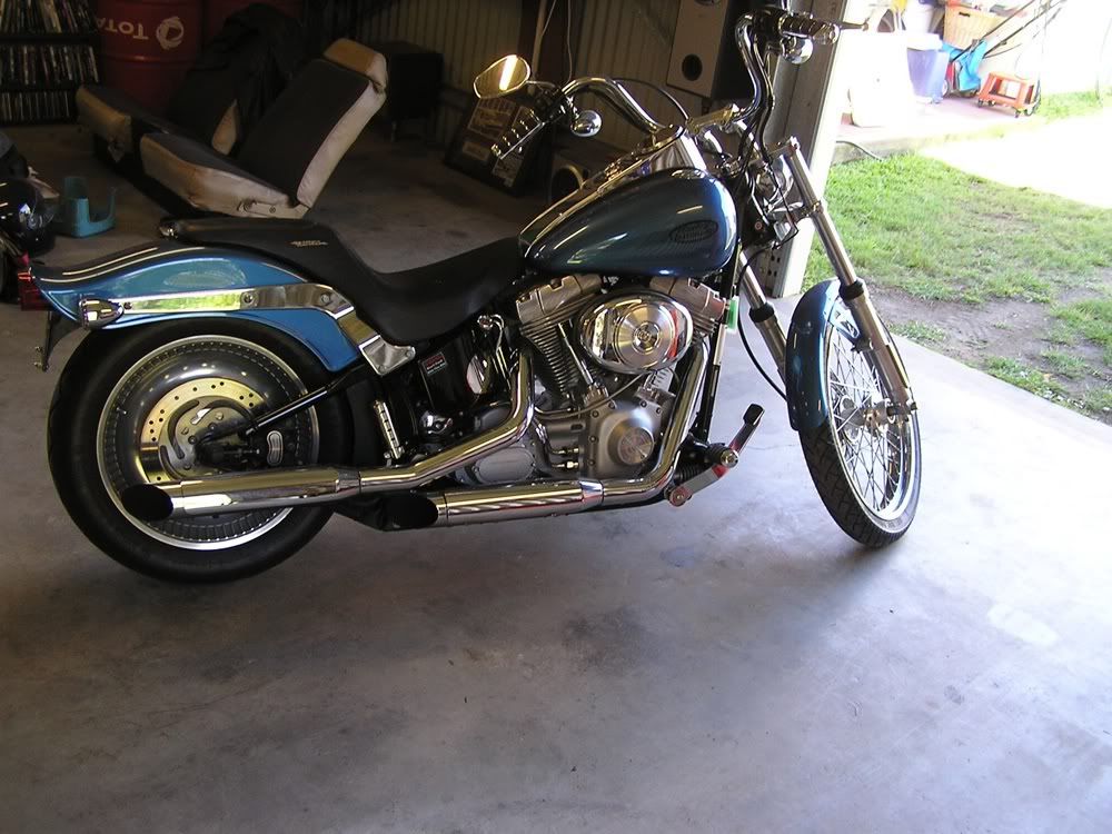 http://i867.photobucket.com/albums/ab240/bomber_watson/harley/lowering4.jpg